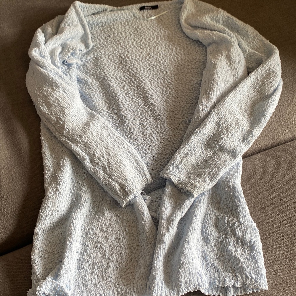 I am selling a BiBA light Blue Shrug with little pompon